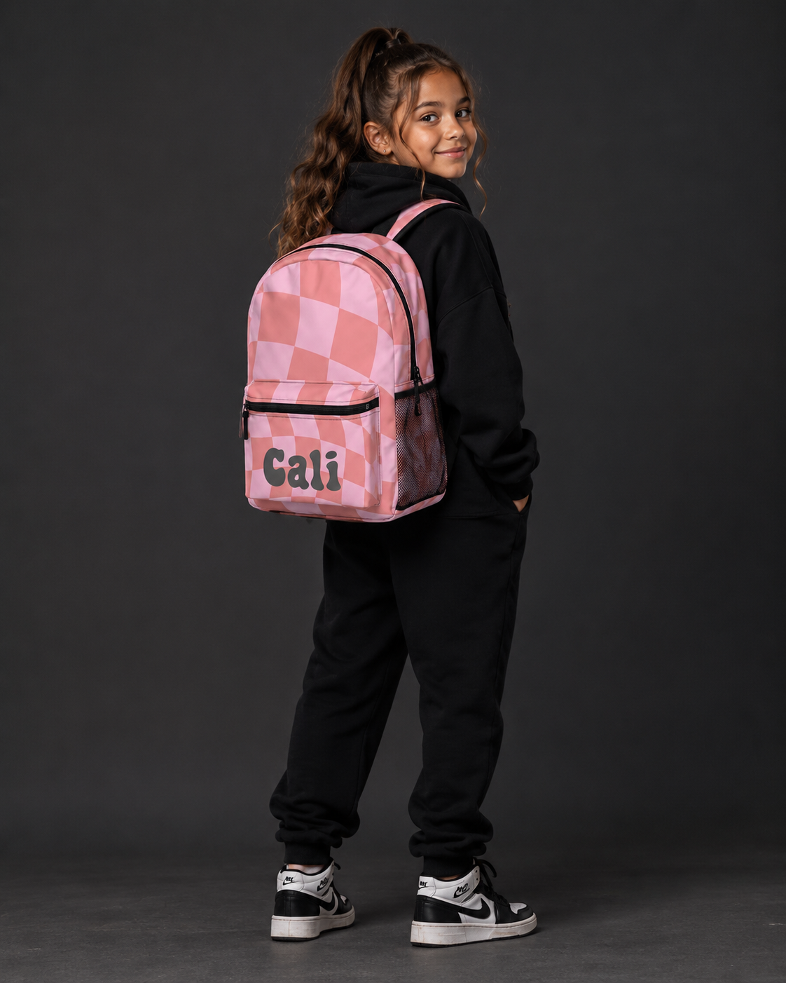 saints model with checkered backpack