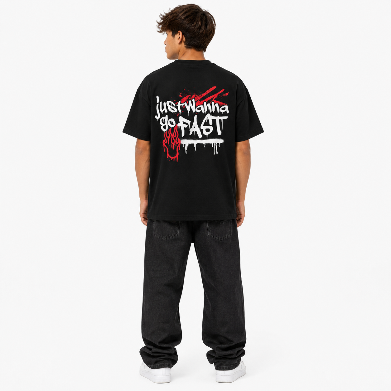 Person wearing a black t-shirt with white text on the back, standing against a white background