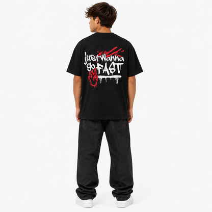 Person wearing a black t-shirt with white text on the back, standing against a white background