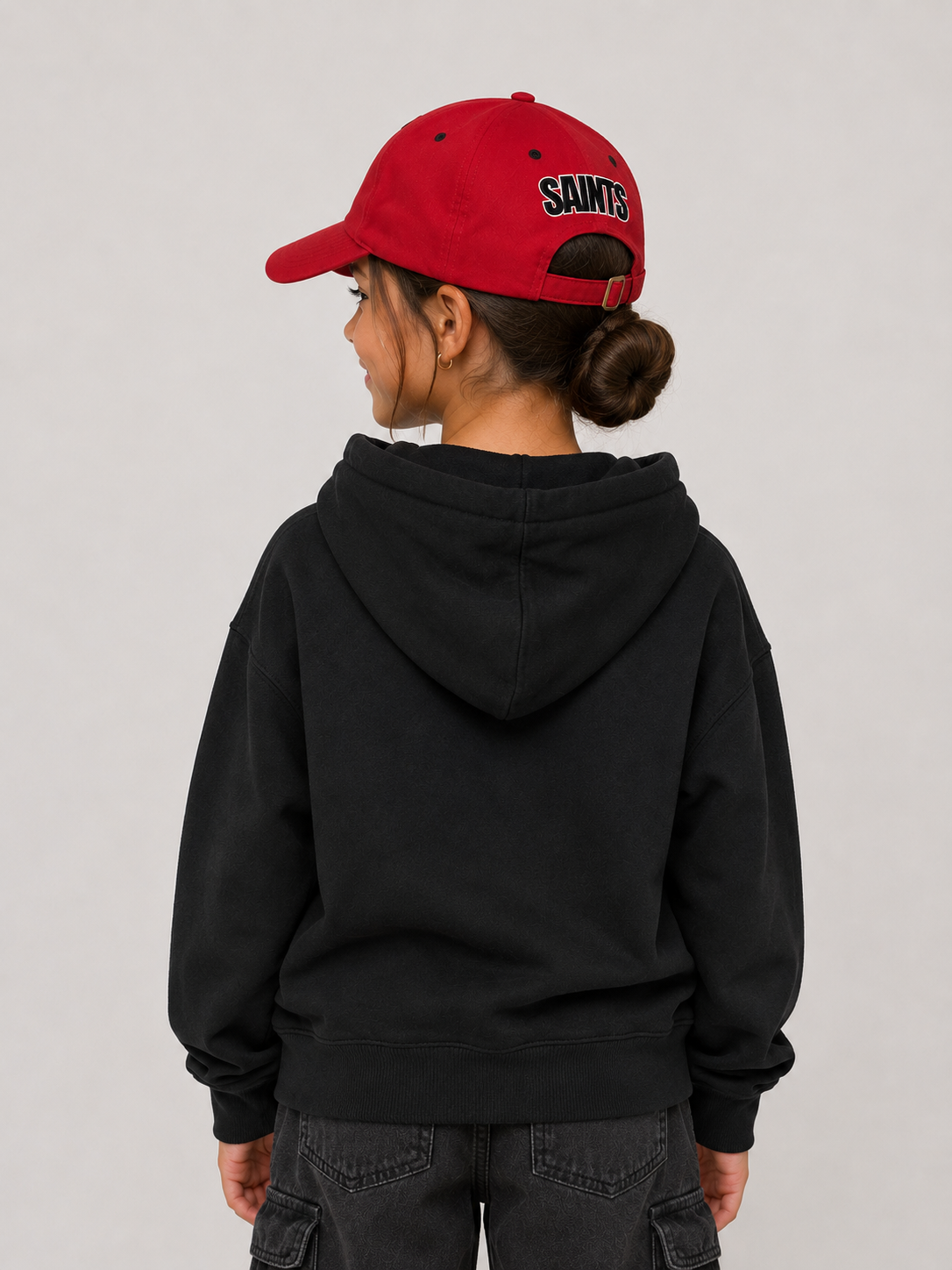 model wearing red saints cap