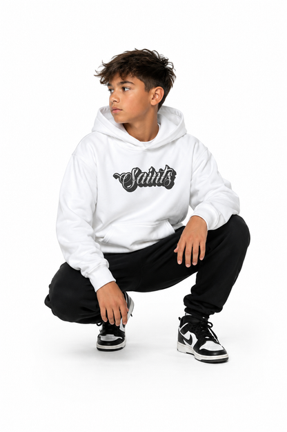 Person wearing a white hoodie with 'Saints' logo on a white background