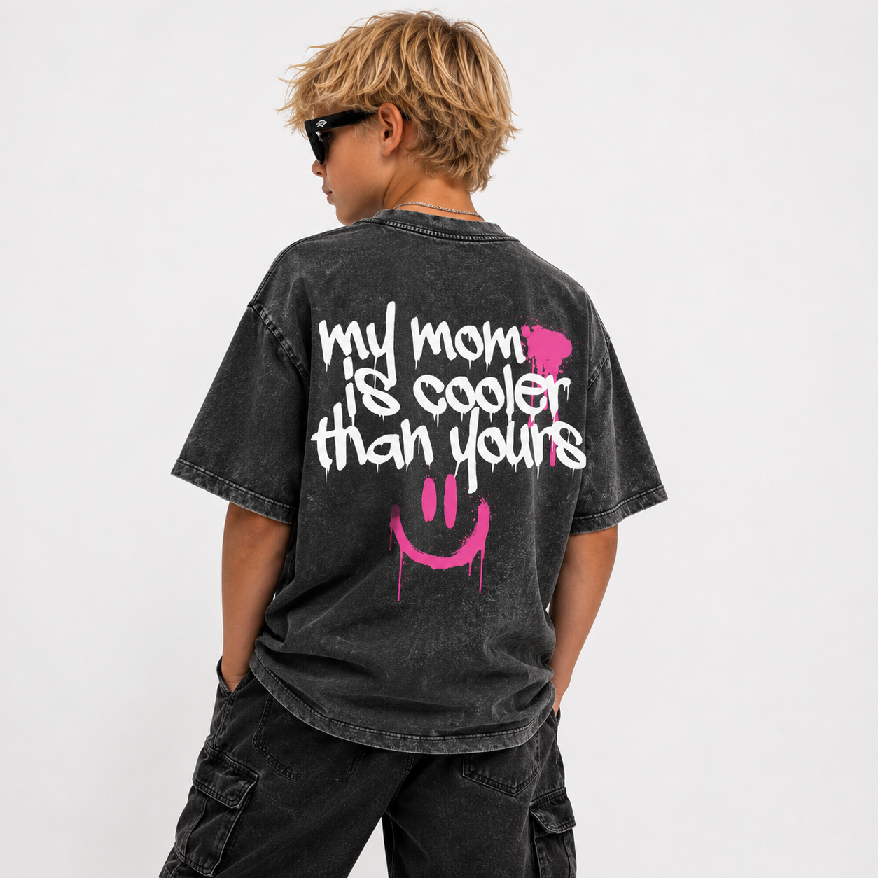 model wearing stone-washed tee that says my mom is cooler than yours with graffiti