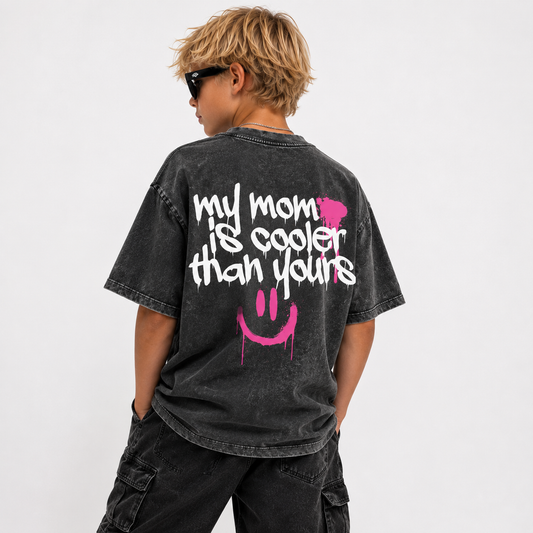 model wearing stone-washed tee that says my mom is cooler than yours with graffiti